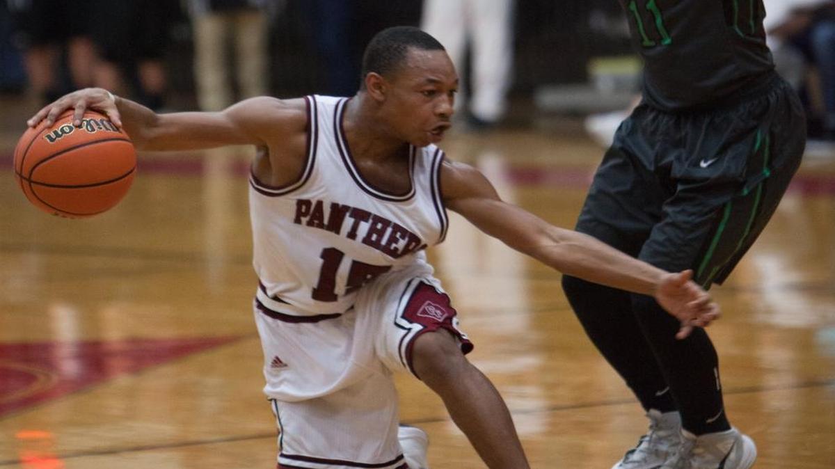 Carolina Forest’s Richmond Collier slides past Bluffton’s Jeremiah McCants during the teams’ first round playoff matchup Wednesday night.