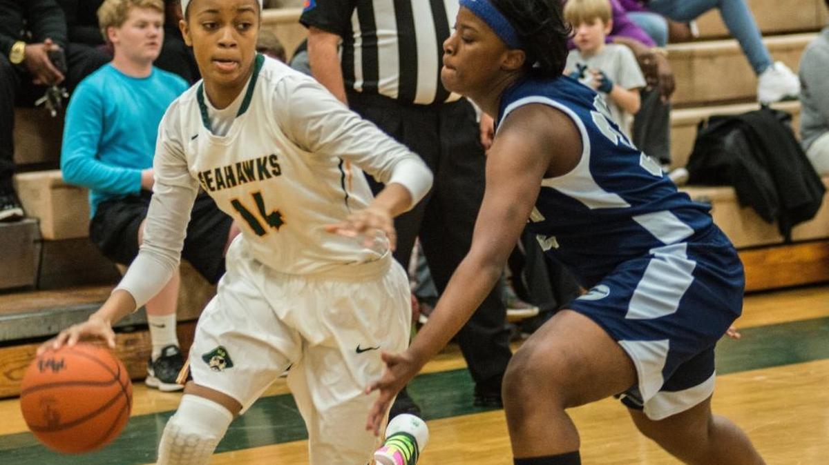 Nia Sumpter (left) drives past a Georgetown defender during Tuesday’s game.