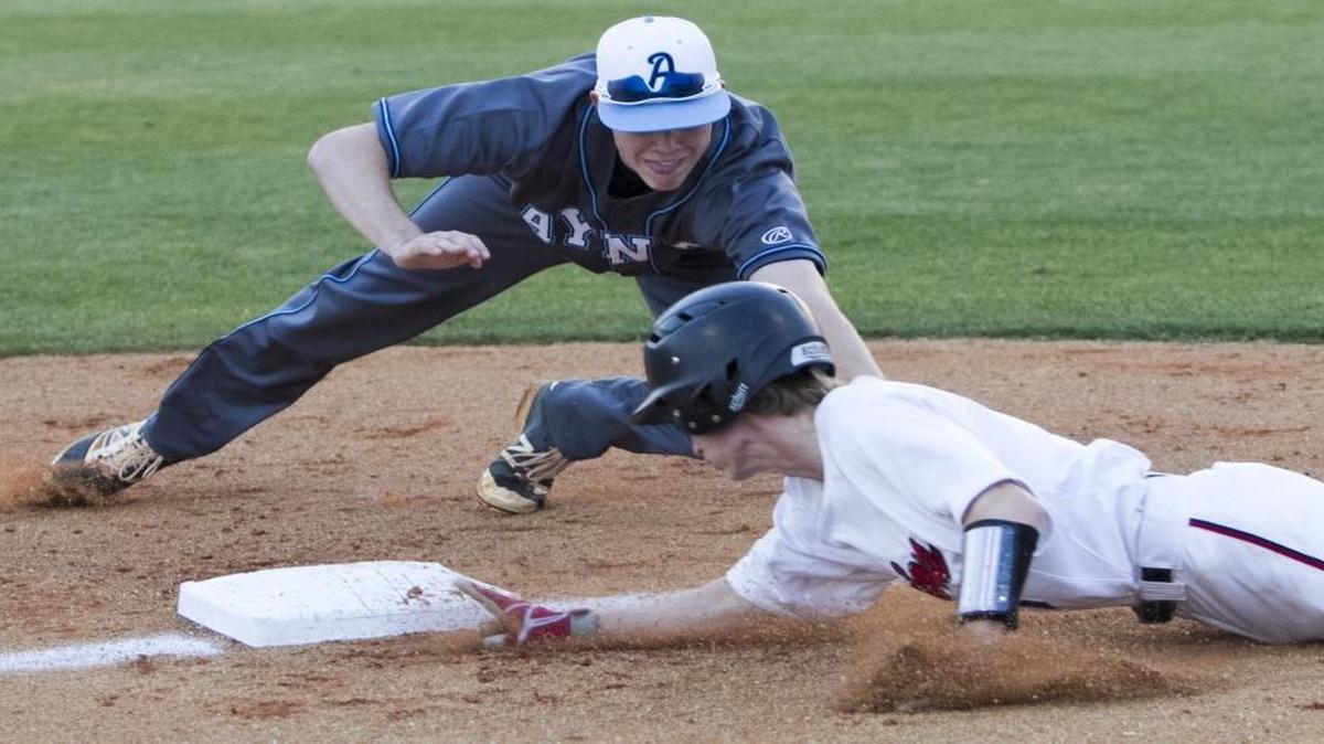 Aynor third baseman Walt Richardson just misses the tag on Waccamaw’s Jake Adkins during a game earlier this season.