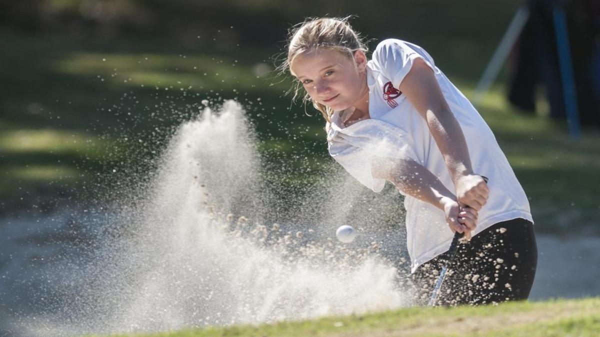 Waccamaw’s Lauren Maser hits out of a bunker during the Class AA state championship tournament at Black Bear Golf Club.
