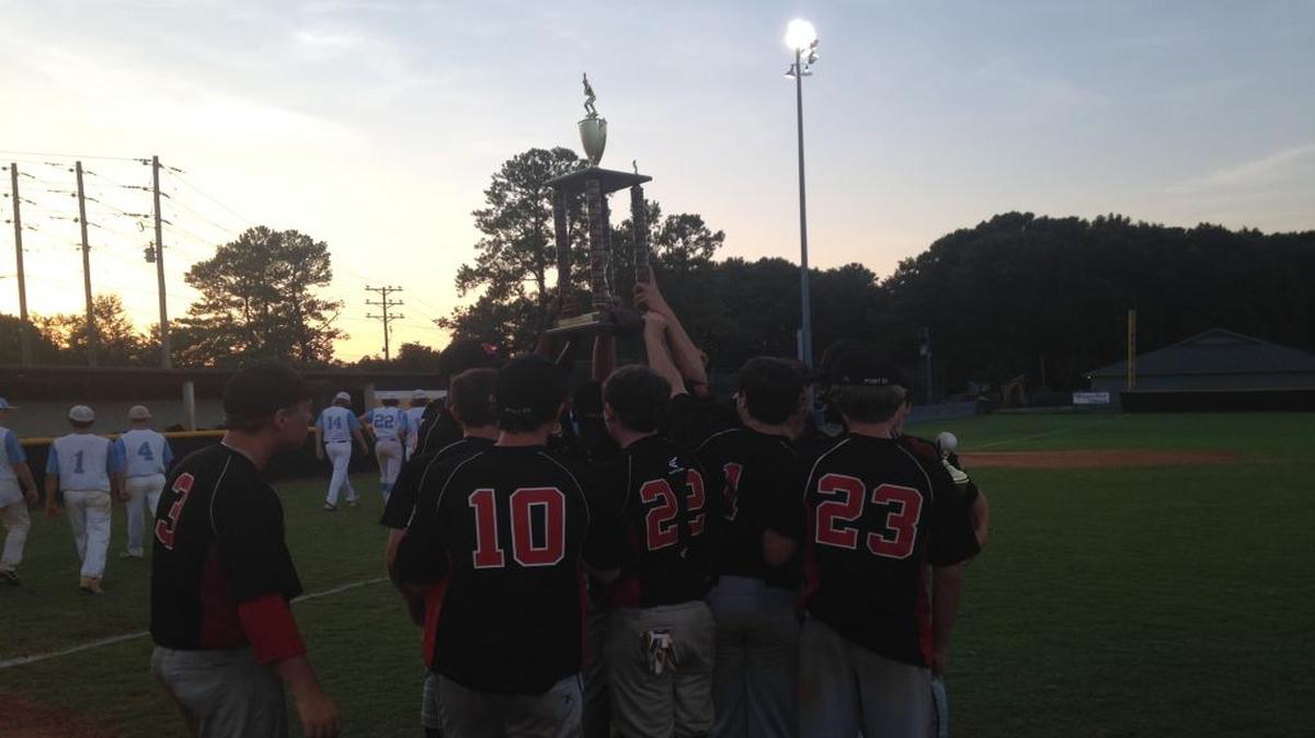 Hartsville Post 53 players hoist the S.C. Junior American Legion championship trophy after downing South Florence, 5-0, to claim the state crown.