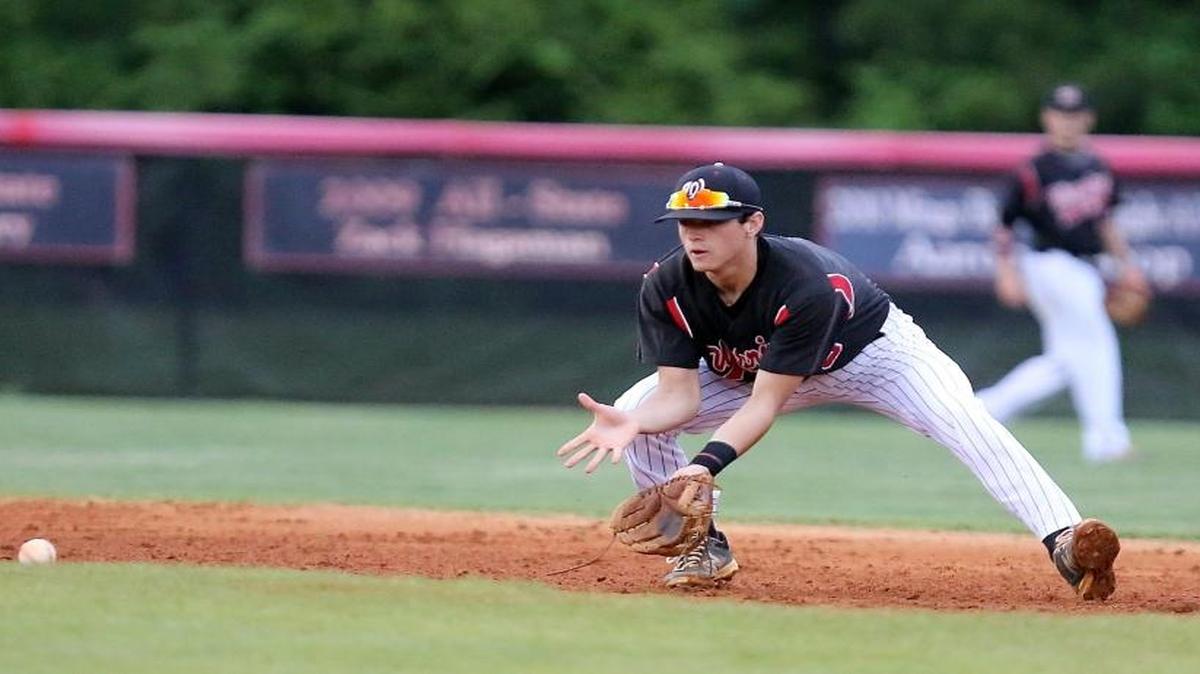 Waccamaw’s McKinley Grooms fields a ball during the Warriors’ playoff opener against Timberland this past season. The senior standout was selected to the South 4A/3A team on Monday.
