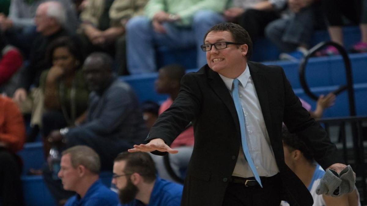 St. James boys basketball coach Jeremy Heinold instructs his team during a recent game.