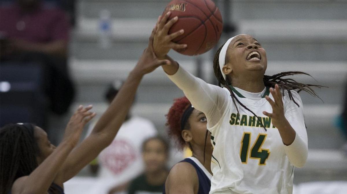 Myrtle Beach forward Nia Sumpter (14) goes to the basket against Hillside during the second half Saturday.