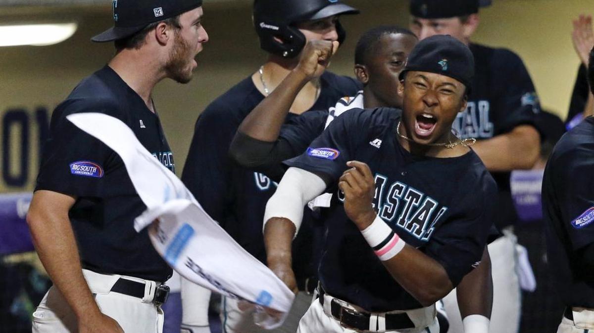 The Coastal Carolina dugout reacts to Connor Owings’ two-run homer during the seventh inning of last Saturday’s super regional game with LSU.