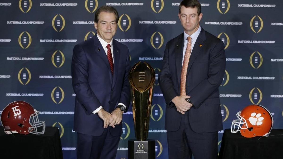 Clemson coach Dabo Swinney (right) and Alabama coach Nick Saban pose for a picture during a news conference Sunday.