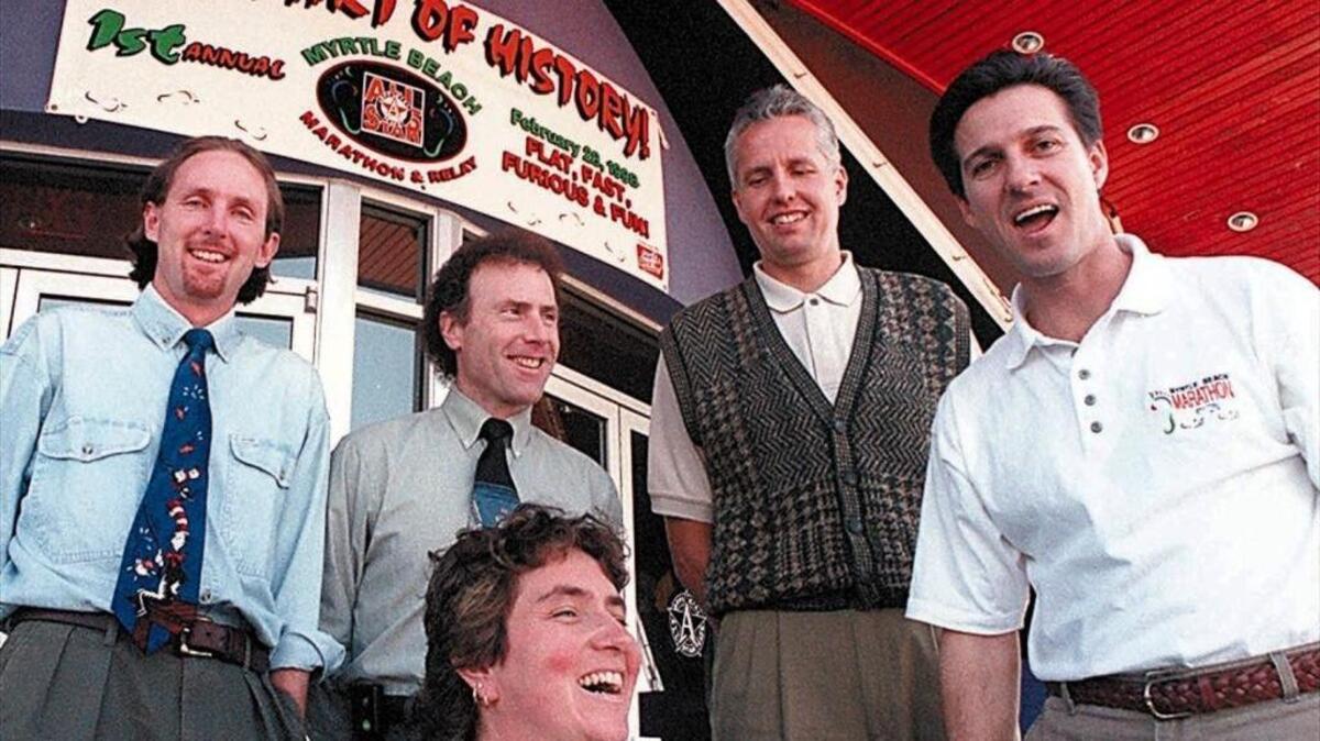 Five organizers gather before the first Myrtle Beach Marathon in 1998. From left is Shaun Walsh, Mark Schecker, Nancy O'Connor (kneeling), Tom Gardiner and Steve Brakefield.