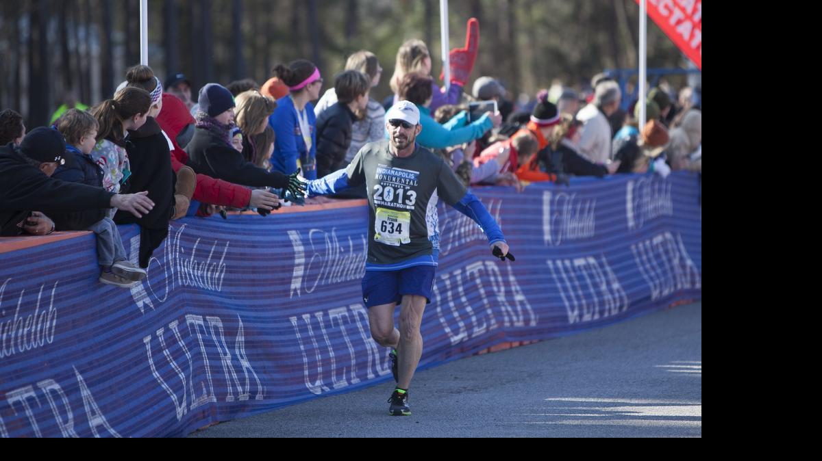 
Frank Irwin of Fairborn, Ohio, greets the crowd as he finishes the 2015 Myrtle Beach Marathon.
