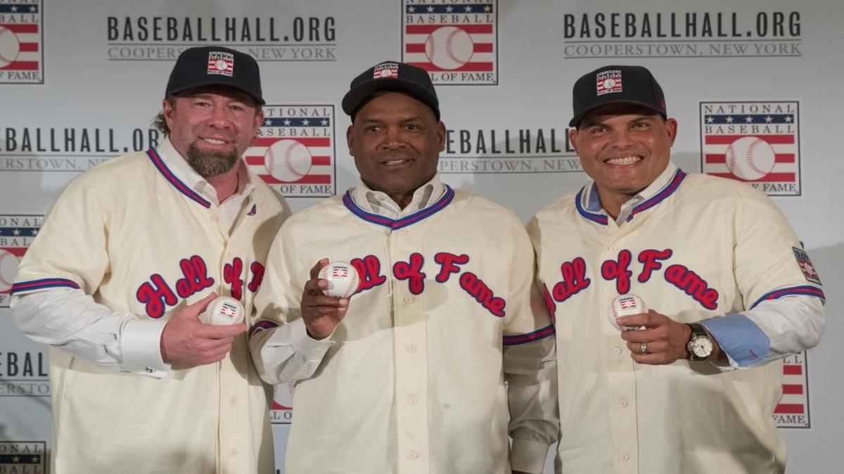 Newly elected Baseball Hall of Fame inductees Jeff Bagwell, left, Tim Raines, center, and Ivan Rodriguez, pose for a photo during a news conference Thursday.