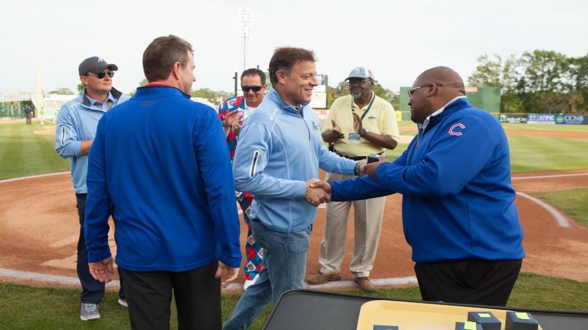 Myrtle Beach Pelicans managing partner Chuck Greenberg is presented with his Cubs affiliate World Championship rings April 16.