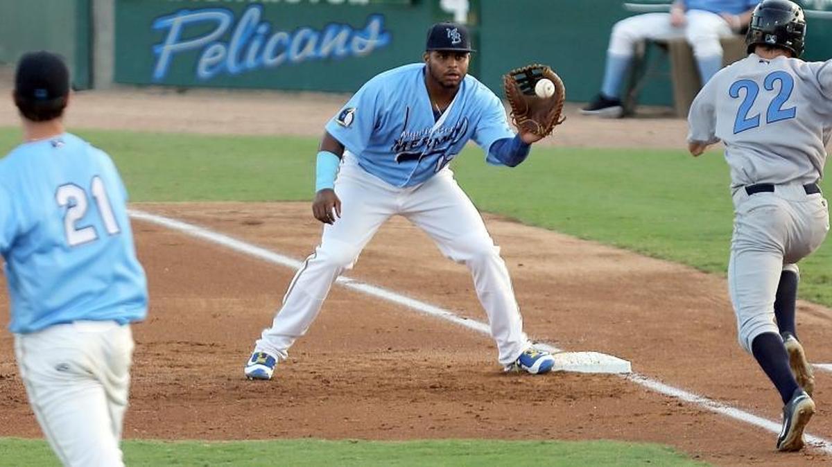 Pelicans slugger Yasiel Balaguert (middle) had three hits in Monday’s win over the Carolina Mudcats
