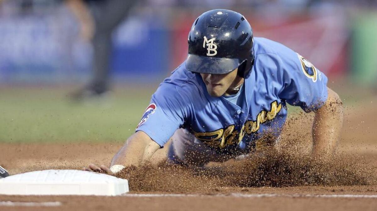 
Myrtle Beach Pelicans' Mark Zagunis dives into first base in game with the Winston-Salem Dash on Thursday.
