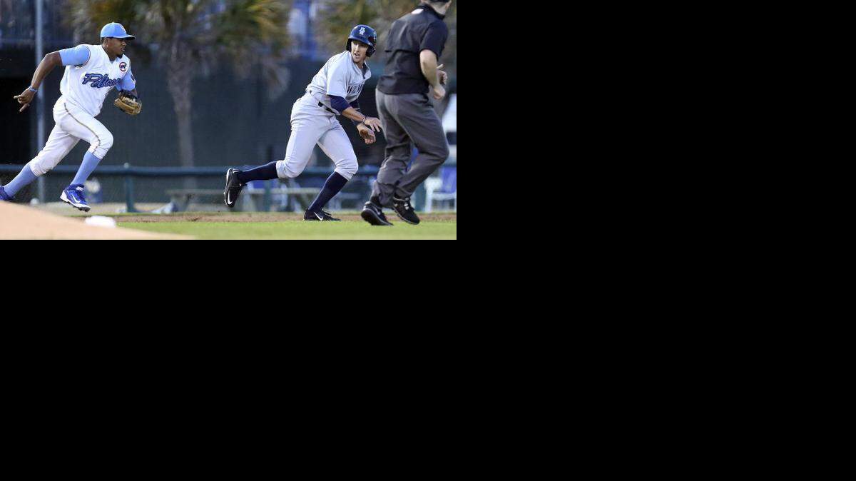 
Pelicans' Jeimer Candelario chases down and tags Blue Rocks' Daniel Rockett as the Myrtle Beach Pelicans take on the Wilmington Blue Rocks on opening night Thursday. The Pelicans will be at home through April 15.
