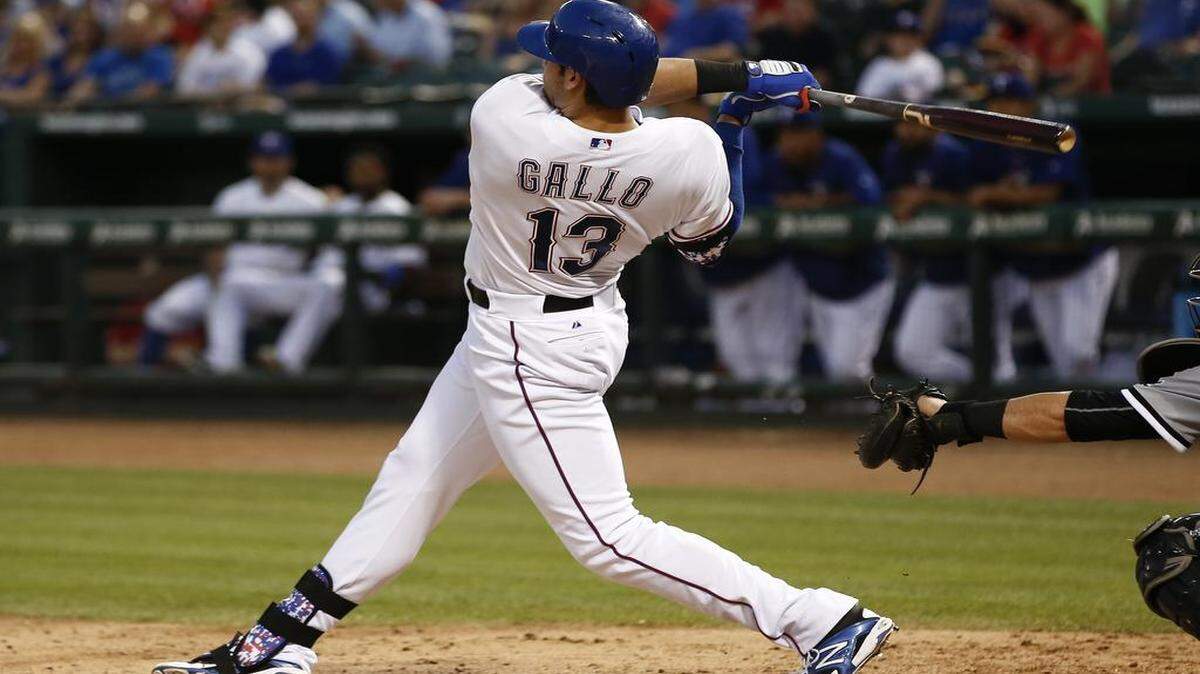 
Texas Rangers' Joey Gallo follows through for a double against the Chicago White Sox during the fifth inning of a baseball game, Tuesday, June 2, 2015, in Arlington, Texas. (AP Photo/Jim Cowsert)

