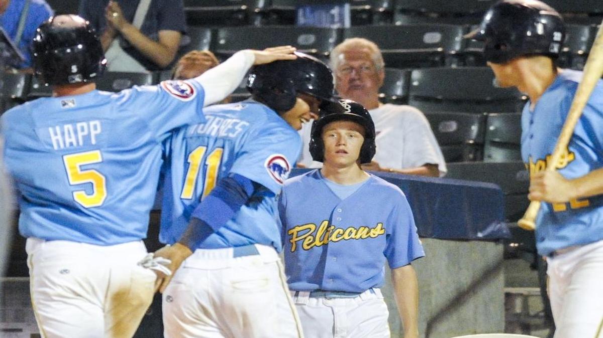 The Pelicans’ Ian Happ and Gleyber Torres congratulate each other after crossing home plate during a recent game.