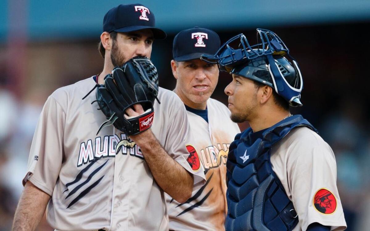
Detroit Tigers pitcher Justin Verlander (left), playing for the Toledo Mud Hens in a rehab start, talks to catcher Miguel Gonzalez (right) and first baseman Mike Hessman (center) in June.
