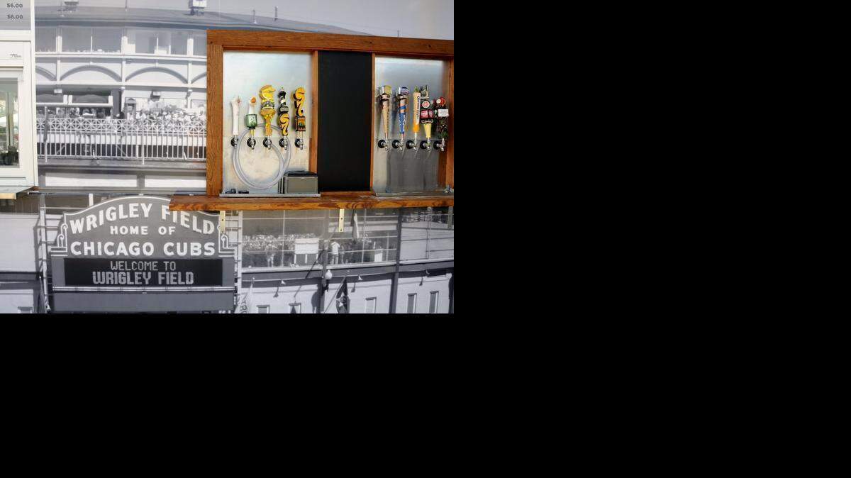 
The Clark & Addison Grille, formerly the Ring of Fire Grille, is located down the right-field line of TicketReturn.Com Field at Pelicans Ballpark. The grille is named for the two cross streets, Clark and Addison, outside of Wrigley Field in Chicago. The new design features a black and white portayal from the corner of Clark & Addison on the front of the building as well as the iconic Wrigley Field Marquee, which sits high atop the structure. The side of the Clark & Addison Grille features a collage of former Cubs players (Ron Santo, Ryan Sandberg, Joseph Tinker, Billy Williams, Frank Chance, Johnny Evers, Billy Herman, Fergie Jenkins and Ernie Banks).
