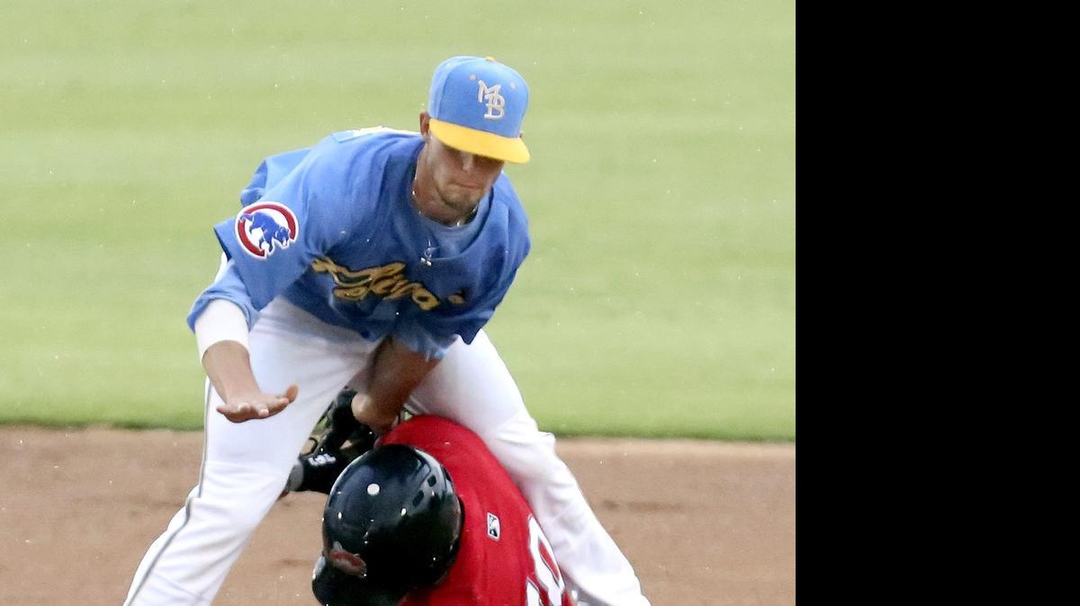 
Myrtle Beach Pelicans' Daniel Lockhart makes the out as Carolina Mudcats' Carlos Franco slides in to second base on Thursday.
