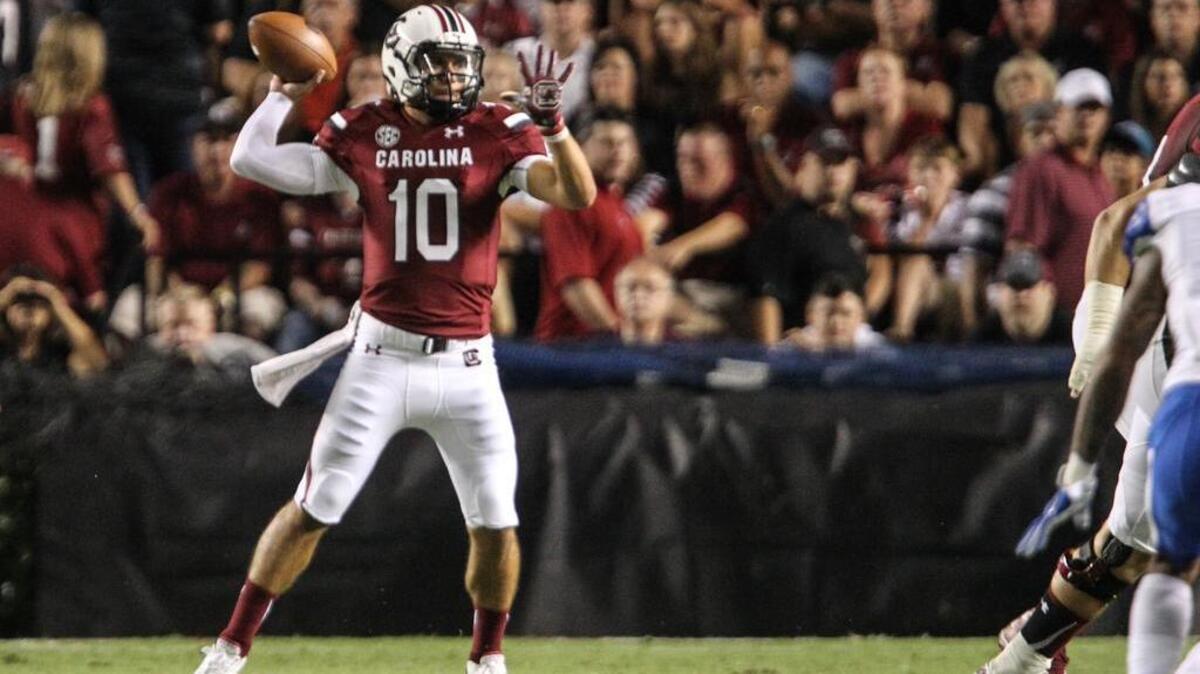 
USC quarterback Perry Orth throws against Kentucky.
