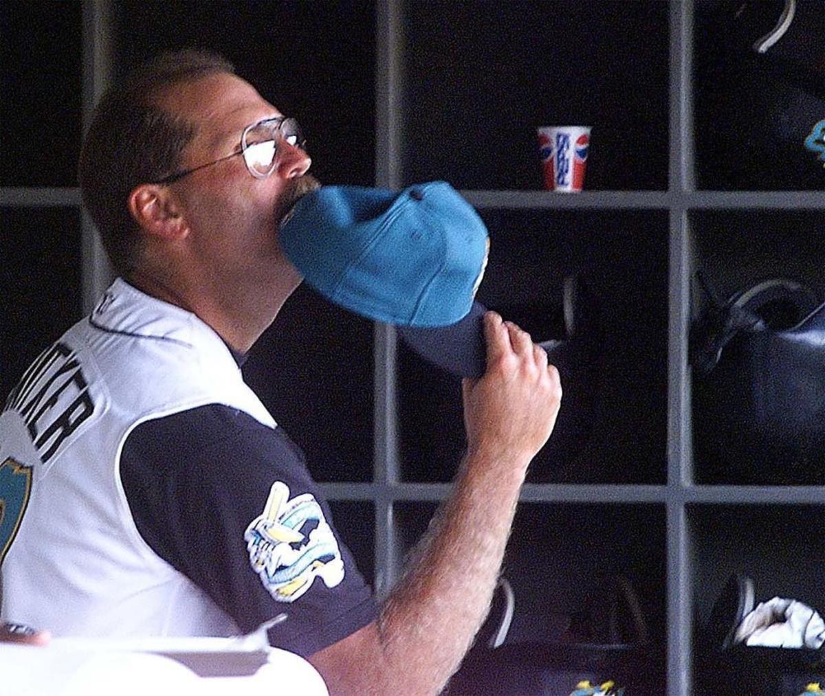 Pelicans Manager Brian Snitker chews his hat between innings of a game during his time as Myrtle Beach Pelicans manager.