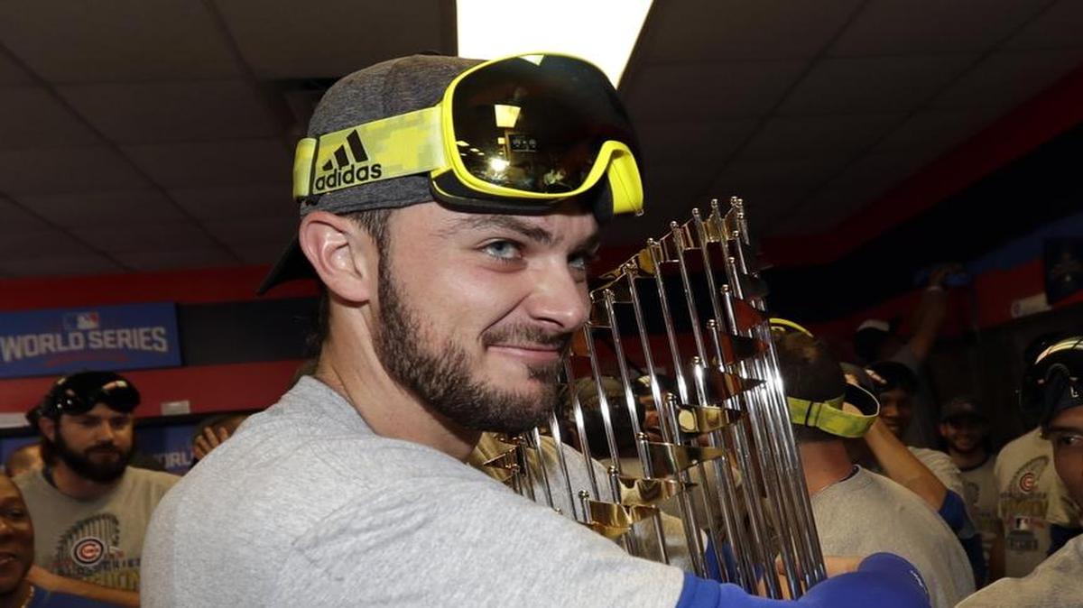 The Chicago Cubs’ Kris Bryant clutches the World Series trophy tightly following the team’s win over the Cleveland Indians in Game 7 of last year’s ‘Fall Classic.’ The trophy earned by the Cubs will be at TicketReturn.com Field at Pelicans Ballpark on Friday as part of this year’s Cubs-A-Palooza celebration.