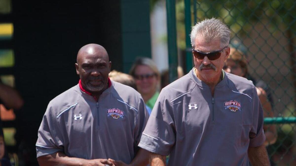 
Former MLB players Mookie Wilson (left) and Bill Buckner take the field for the opening ceremonies of the Waverider Tournament on Sunday at The Ripken Experience in Myrtle Beach.
