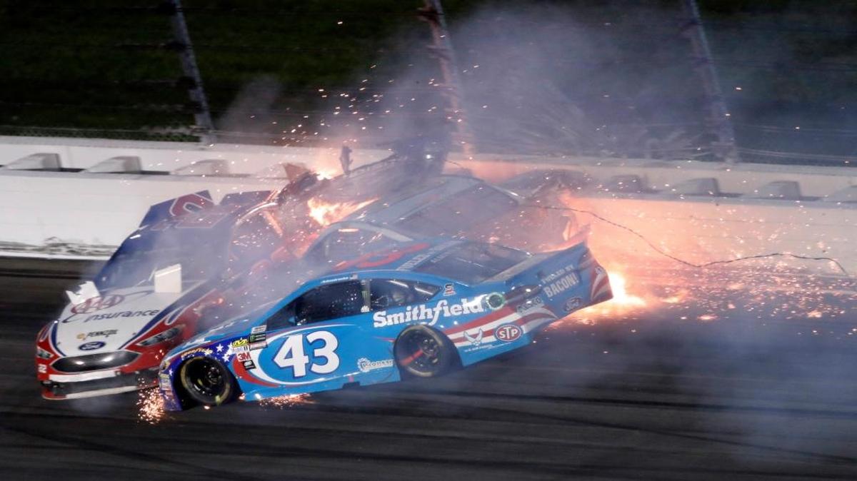 Aric Almirola (43) crashes into Danica Patrick and Joey Logano (22) during Saturday’s race at Kansas Speedway.