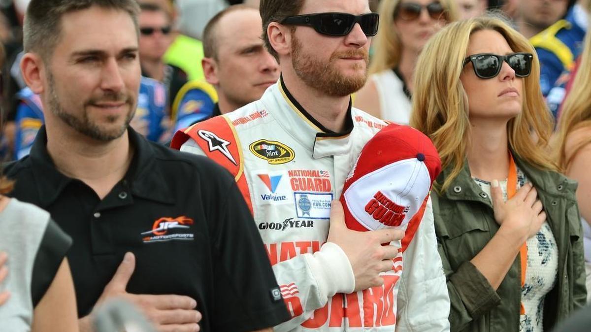 Dale Earnhardt Jr., center in this file photo, proposed to his wife, Amy, in a church in Germany where his ancestors prayed centuries ago.