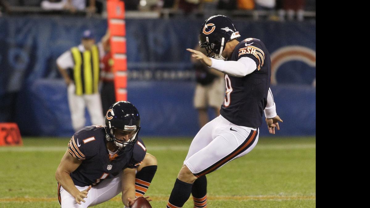 
North Myrtle Beach native Ryan Quigley holds for Bears kicker Robbie Gould.
