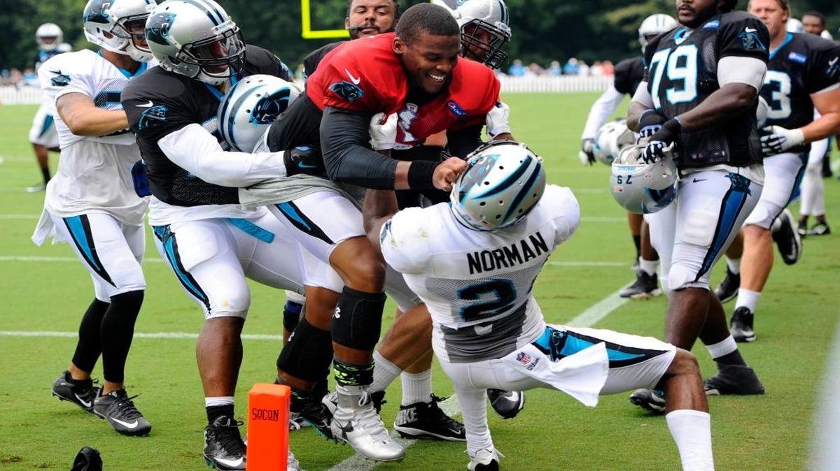 Carolina Panthers quarterback Cam Newton (1) and cornerback Josh Norman (24) had to be separated after a skirmish in practice on Aug. 10, 2015.