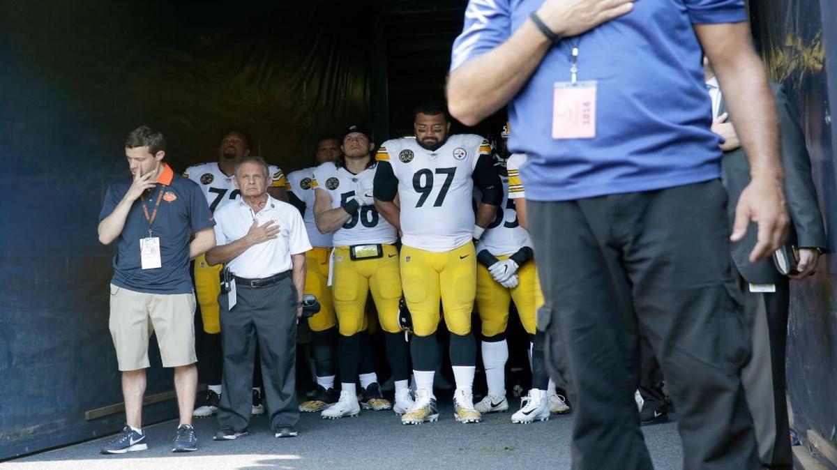 Pittsburgh Steelers players stand in the tunnel during the playing of the national anthem before Sunday’s game against the Chicago Bears.