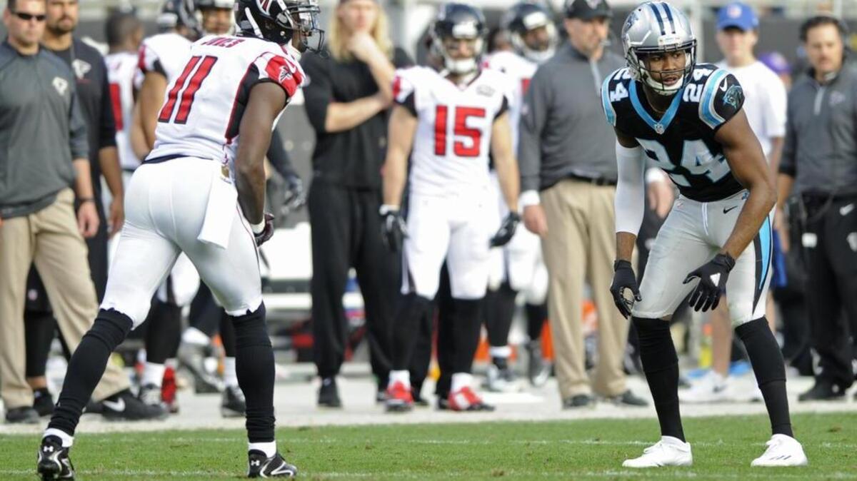 Atlanta Falcons' Julio Jones (11) faces off against Carolina Panthers' Josh Norman (24) in the second half of an NFL football game in Charlotte, N.C., Sunday, Dec. 13, 2015. (AP Photo/Mike McCarn)
