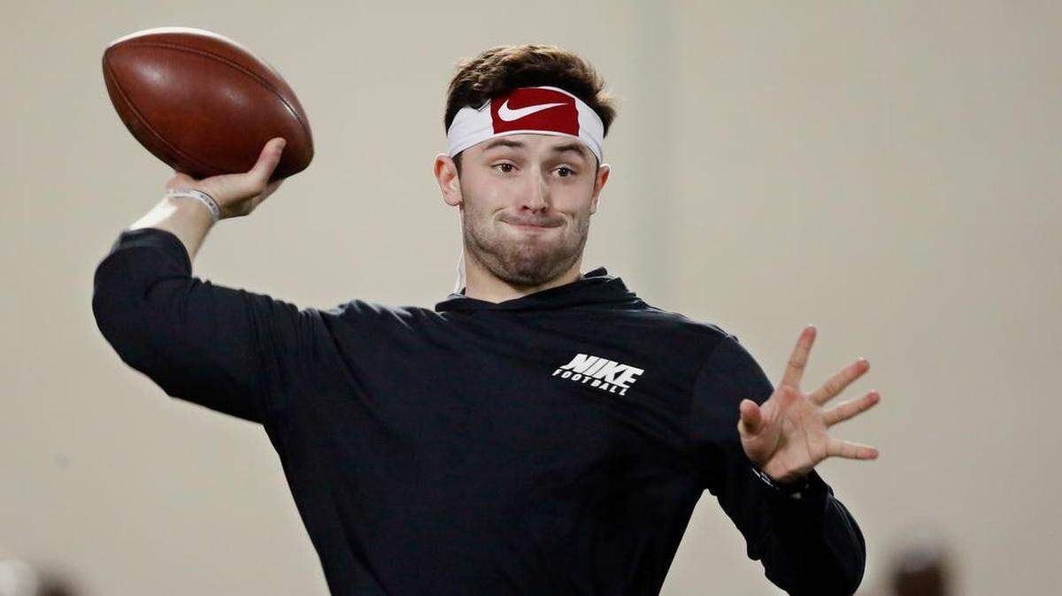 Oklahoma quarterback Baker Mayfield passes during a drill at an NCAA college football Pro Day workout in Norman, Okla., Wednesday, March 14, 2018.
