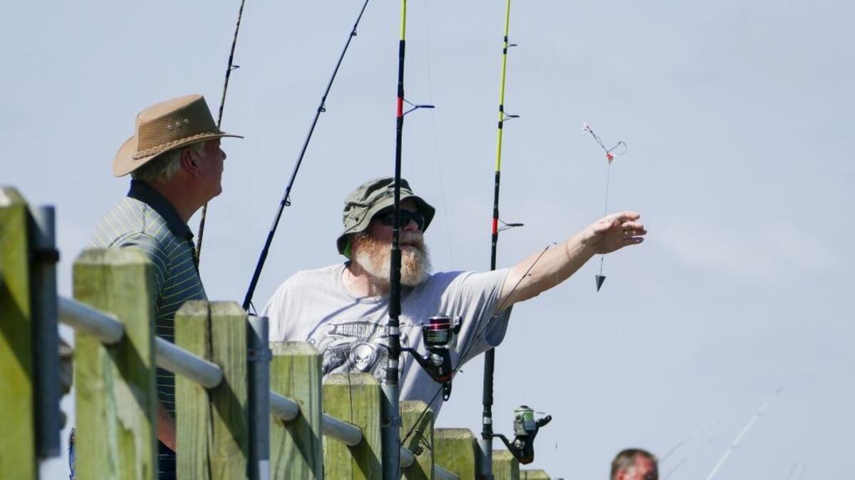 Fishermen line the public fishing dock at Cherry Grove Park in North Myrtle Beach.