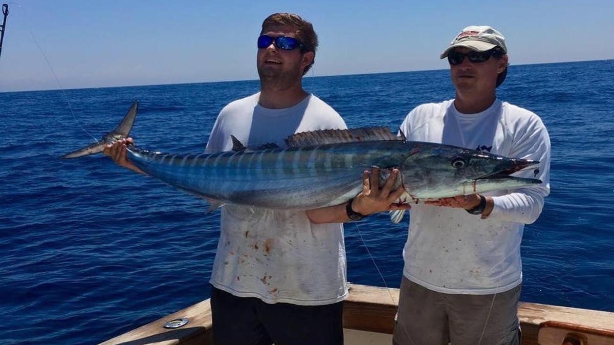 Henry Eddy of Conway and Eric Mitchell of Murrells Inlet show off a 59.83-pound wahoo caught aboard Seabatical during the inaugural Marlin Quay Carolina Slam out of Murrells Inlet.