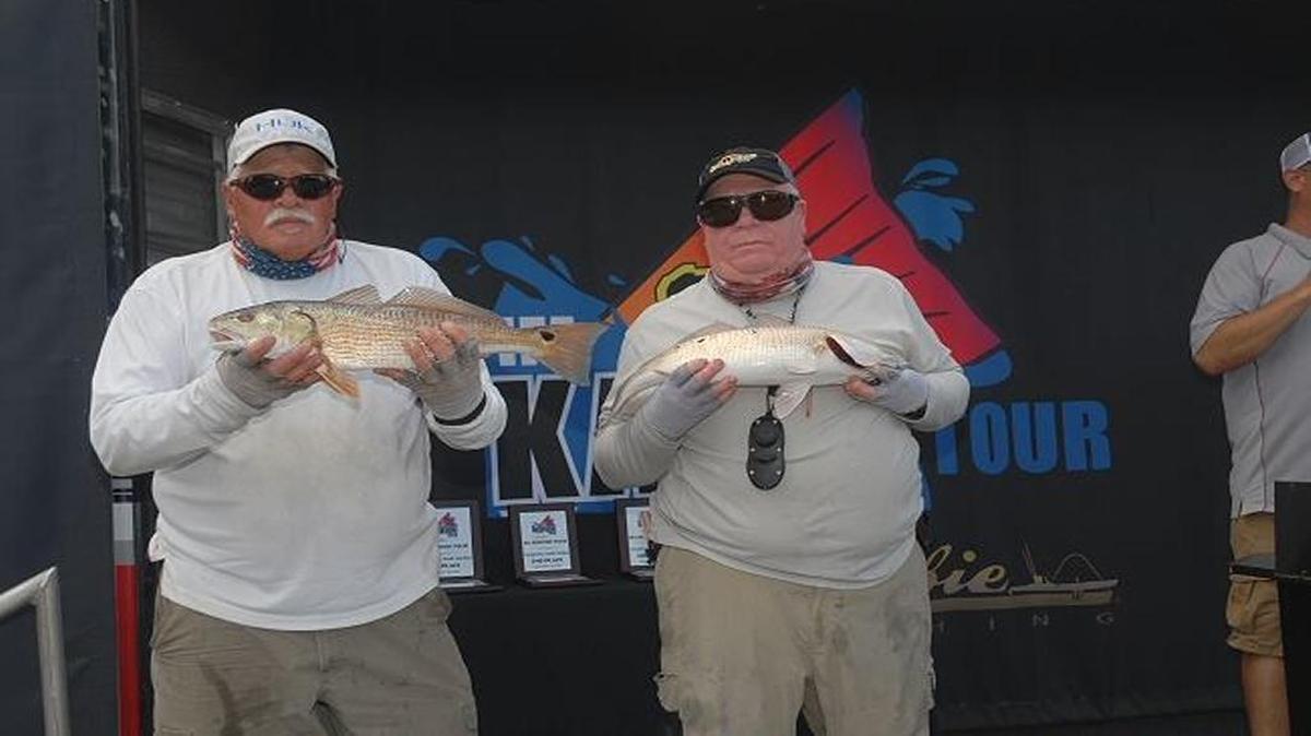 Capt. Lin Fore and Capt. Mike McDonald of Georgetown show off their winning fish in the IFA Redfish Tour Atlantic Division tournament last Saturday in Georgetown.