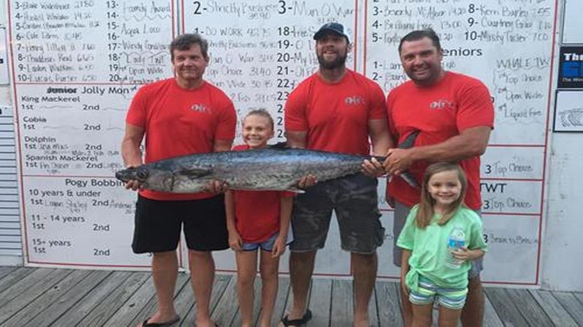The crew of Do Work/OIFC shows off the winning 42.75-pound king mackerel last Saturday in the Jolly Mon King Classic at Ocean Isle Fishing Center. From left are Jeff Beck, Camdyn Beck, Jeremy Phillips, Jon Hayes and Ivy Hayes.
