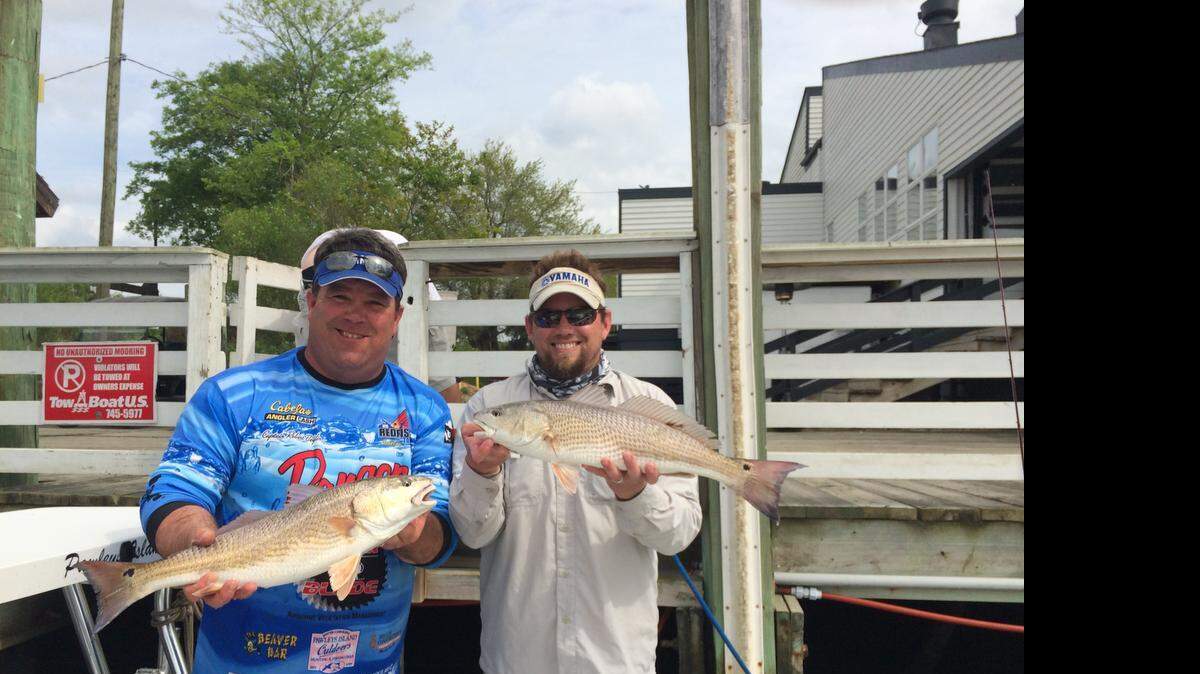 
Capt. Rob Beglin and Eric Gobbett display the winning red drum from the Lowcountry Redfish Cup event Saturday in Mount Pleasant before the fish were released.
