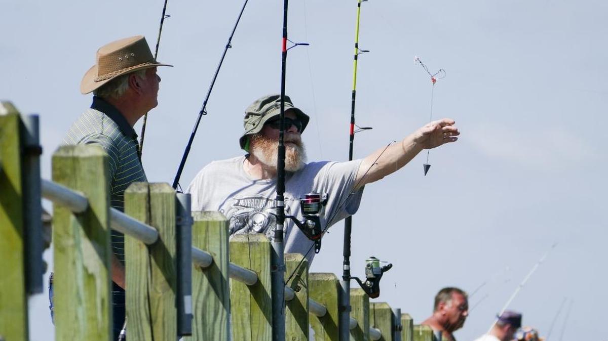 Fishermen line the public fishing dock at Cherry Grove Park at 53rd Avenue North in North Myrtle Beach.