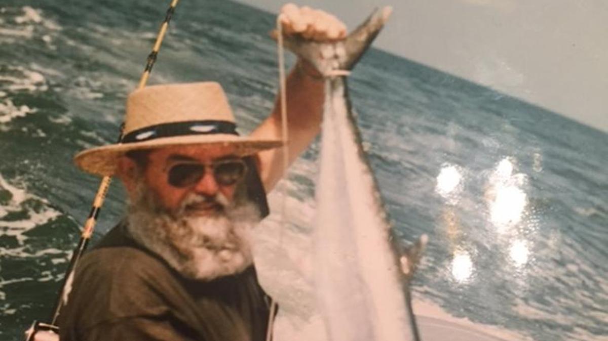 The late Carrol Holshouser shows off a king mackerel he caught during his days as a charter captain out of Murrells Inlet.