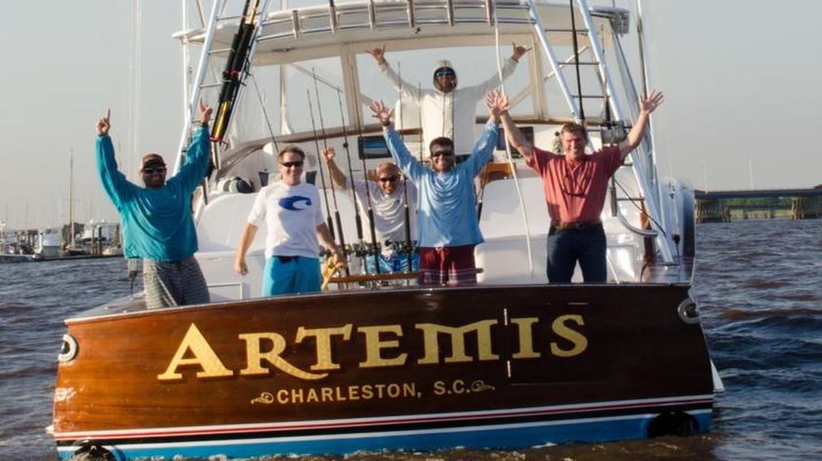 The crew of Artemis celebrates winning the 50th annual Georgetown Blue Marlin Tournament.