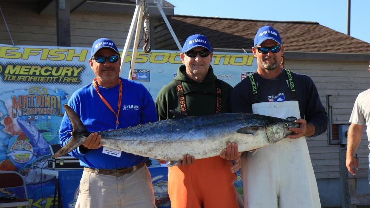 The crew of Back Lash shows off the tournament-best 52.12-pound king mackerel they caught in the SKA Nationals at Morehead City. The crew won the Single Engine Class.