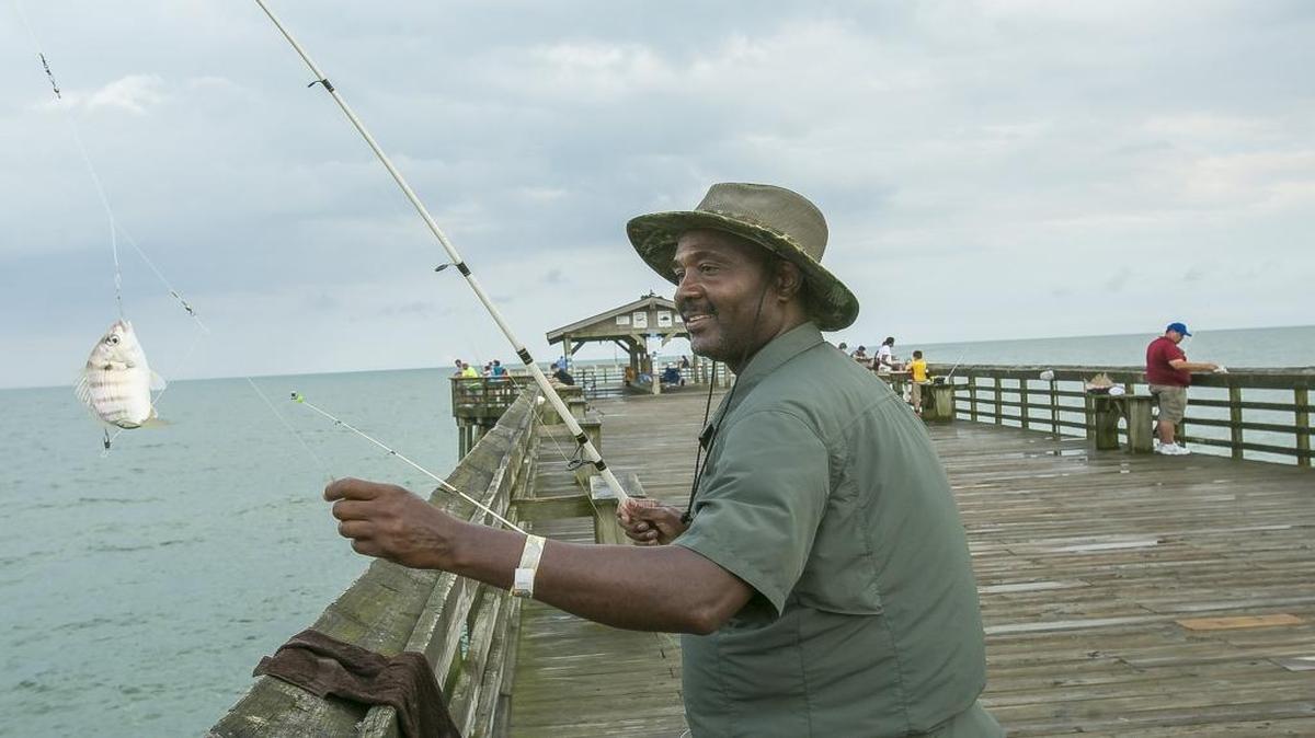 Gene Ward of Conway lands a pin fish on the pier at Myrtle Beach State Park last year.