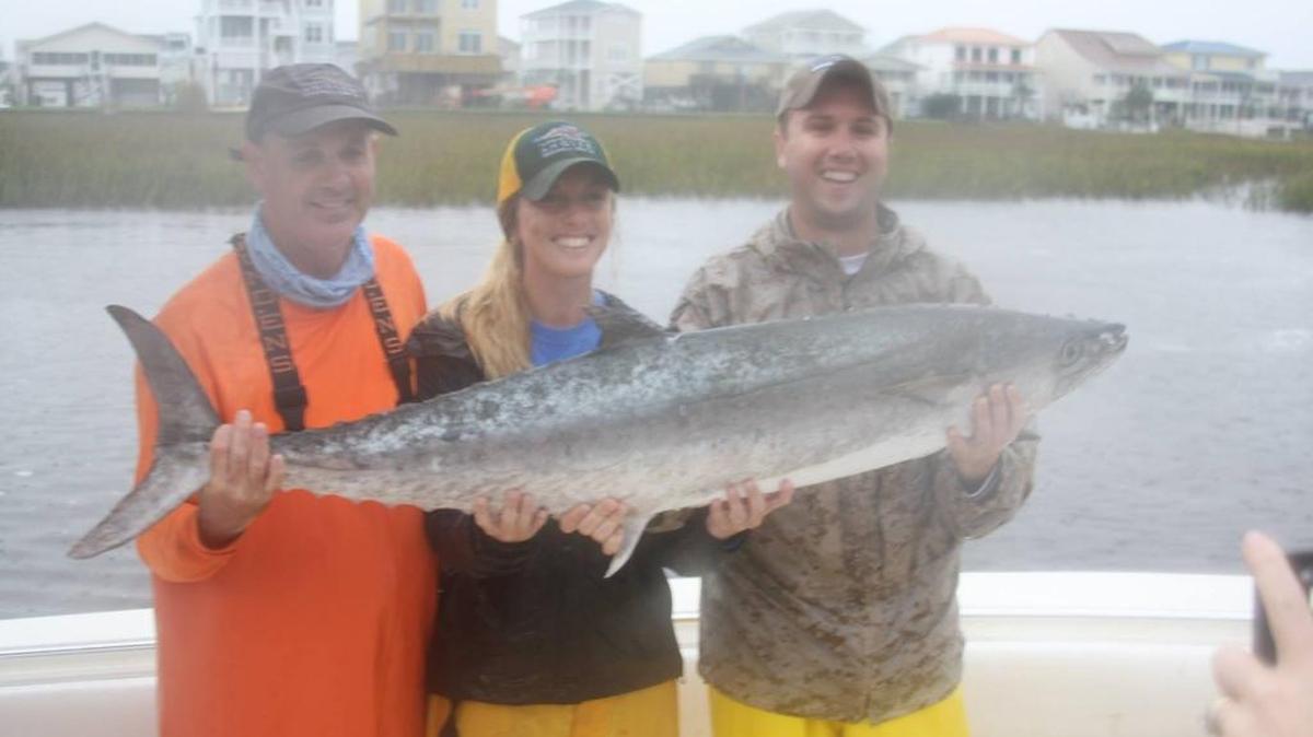 
The crew of Hot Rod including Brett Barnes, Sierra Barnes and Alan Barnes show off the winning 41.85-pound king mackerel they caught last Saturday in the Fall Brawl King Classic out of Ocean Isle Fishing Center.

