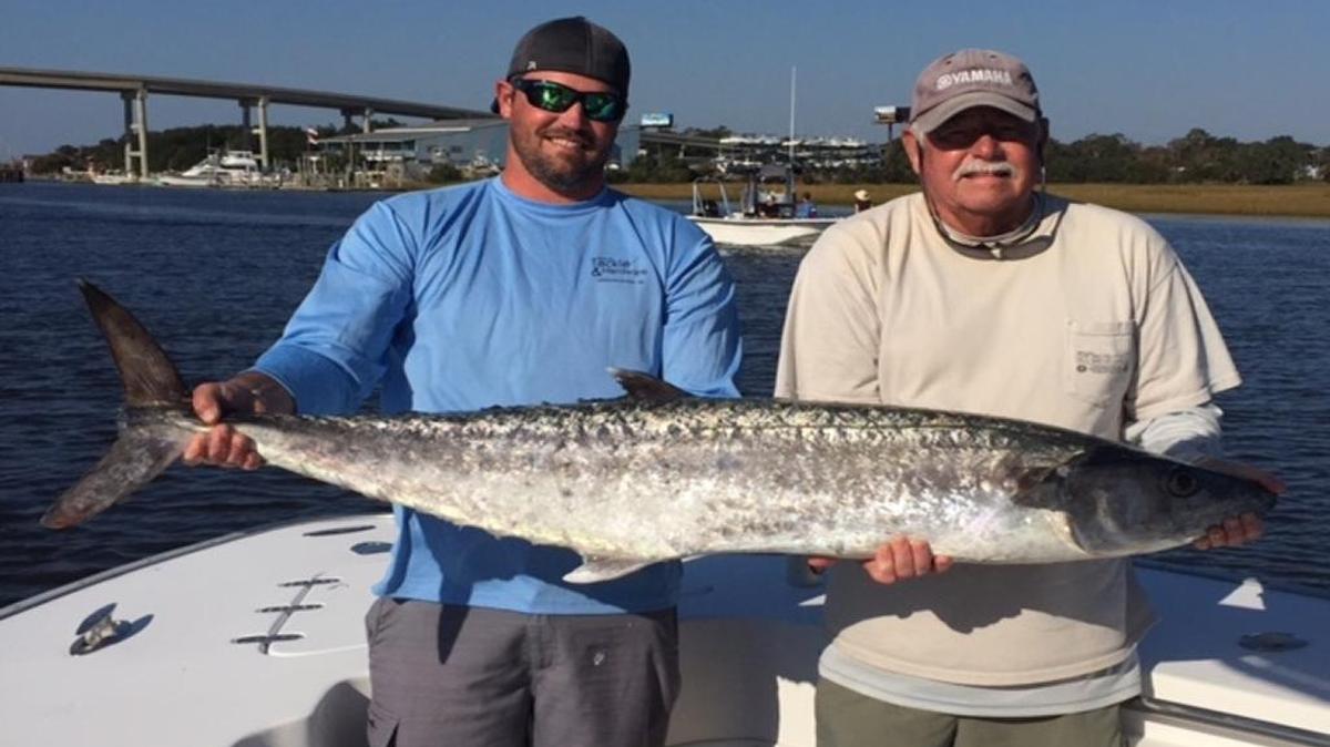 Brent Gainey and Randy Gainey hold the winning 44.20-pound king mackerel in the 2016 Fall Brawl King Classic Sunday at Ocean Isle Fishing Center in Ocean Isle Beach, N.C.