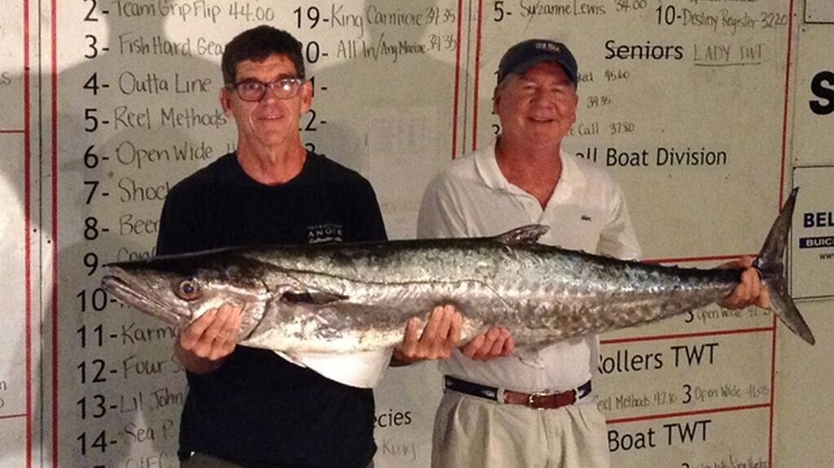 Gaston and Tolly Hughes of Wilmington, N.C., of Team Grip Flip show off the second-place king mackerel in the Fall Brawl King Classic.