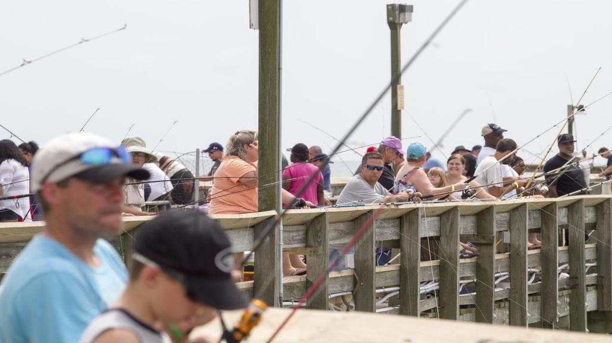 Hundreds of fishermen lined the rails of the Apache Pier during an event last year.