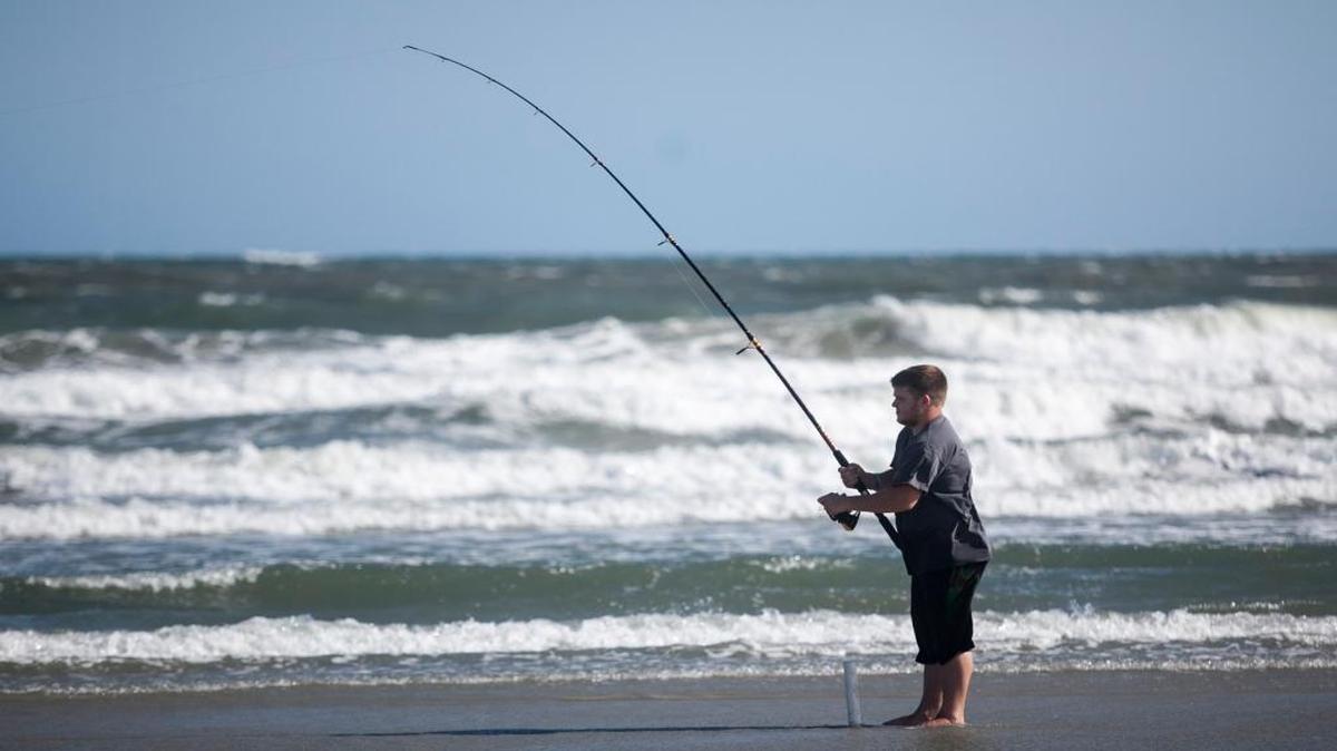 A man surf fishes near 12th Avenue South in North Myrtle Beach.