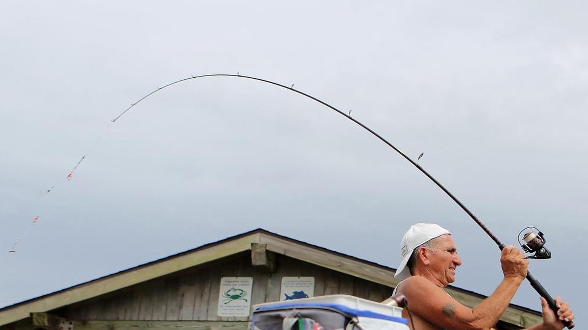Dennis Caruso tosses a line from the Myrtle Beach State Park Pier earlier this summer.