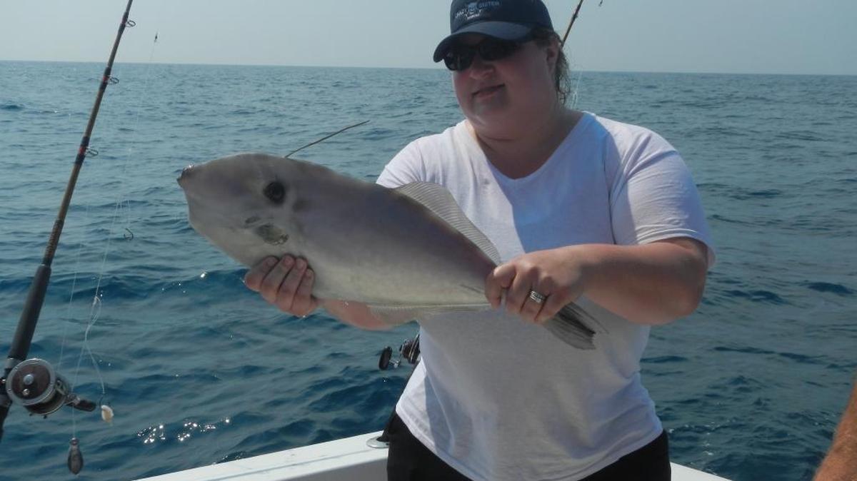 Beth Dollmatsch shows off a rare filefish caught during a fishing trip aboard Side Kick out of Murrells Inlet earlier this week.